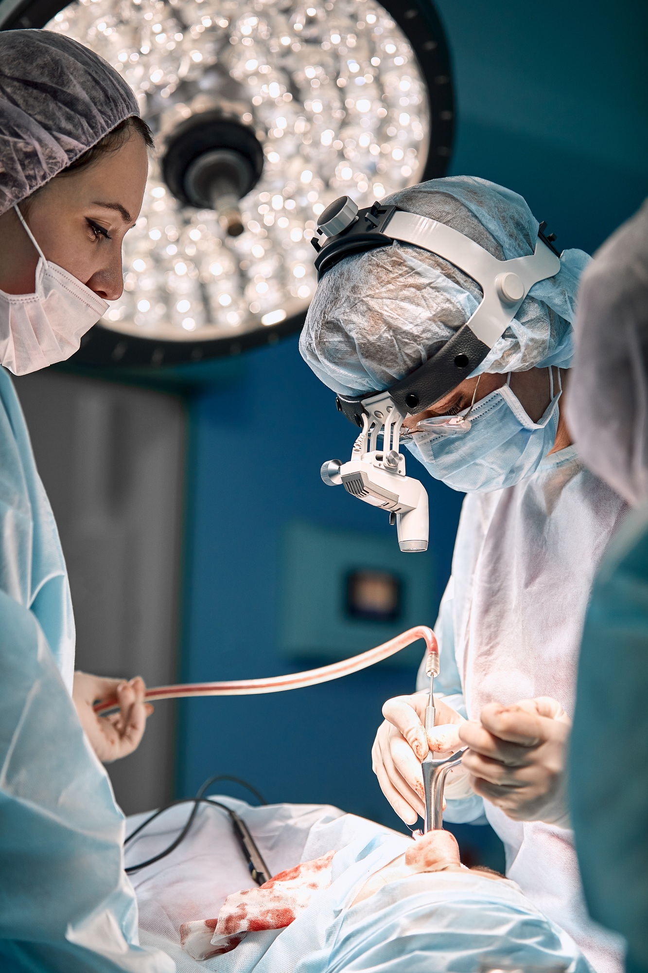 Team of women surgeons in the operating room. A modern team of doctors during an ancological